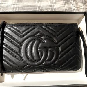 Gucci's sleek leather pouch: stylish and sexy.